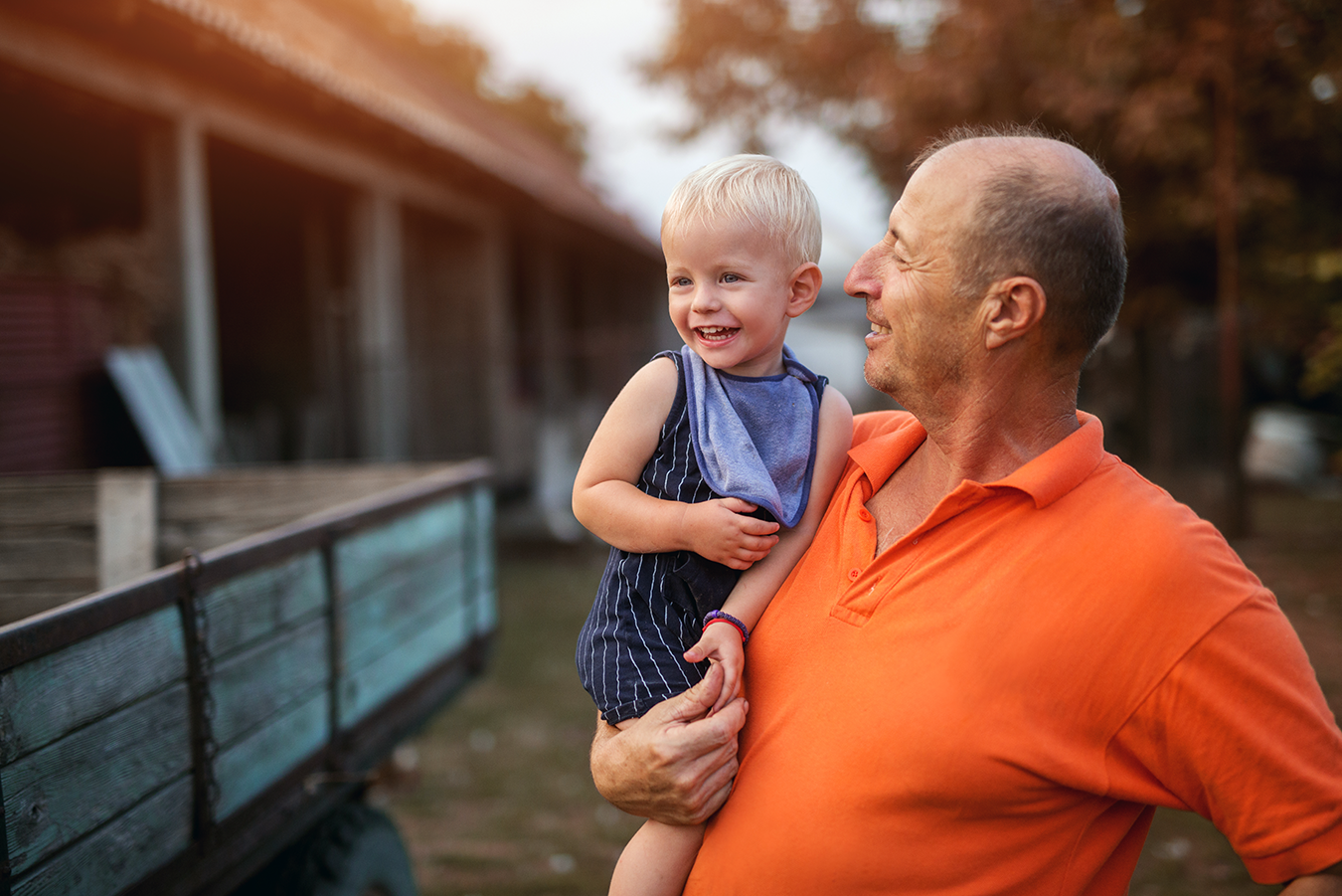 Daniel_neck.pain.relief_holding.grandson.png